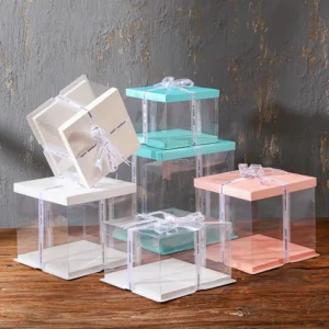 Clear cake boxes with transparent sides in multiple sizes and lid colors for tall and layered cakes